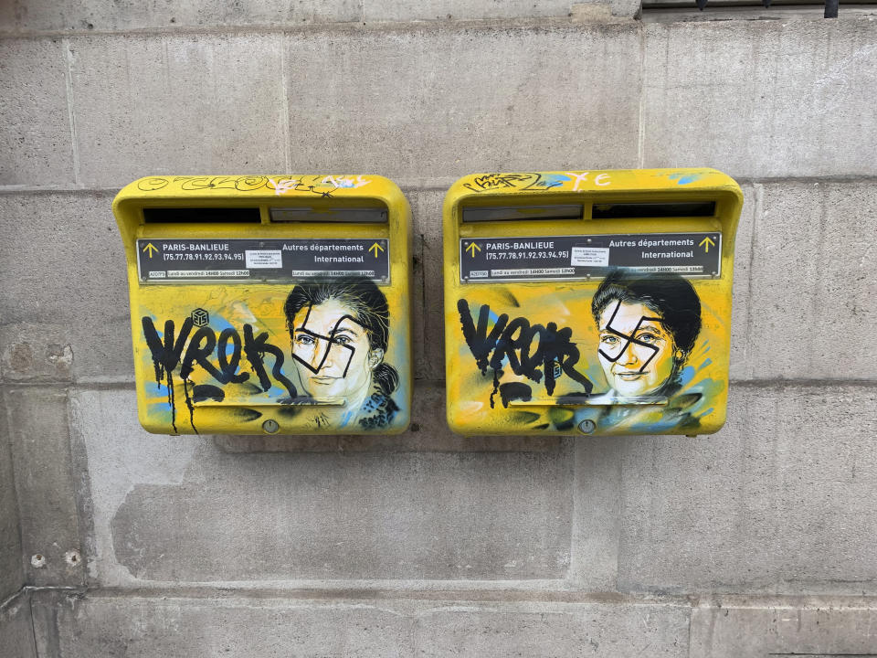 This photo taken on Monday, Feb. 11, 2019 and provided by the Paris city hall of the XIIIth district shows mailboxes with swastikas covering the face of the late Holocaust survivor and renowned French politician, Simone Veil, in Paris, France. According to French authorities, the total of registered anti-Semitic acts rose to 541 in 2018 from 311 in 2017, a rise of 74 percent. (Mairie du XIIIth via AP)