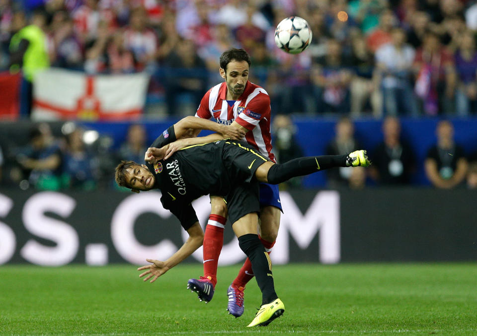 Barcelona's Neymar, left, fights for the ball with Atletico's Juanfran during the Champions League quarterfinal second leg soccer match between Atletico Madrid and FC Barcelona in the Vicente Calderon stadium in Madrid, Spain, Wednesday, April 9, 2014. (AP Photo/Paul White)