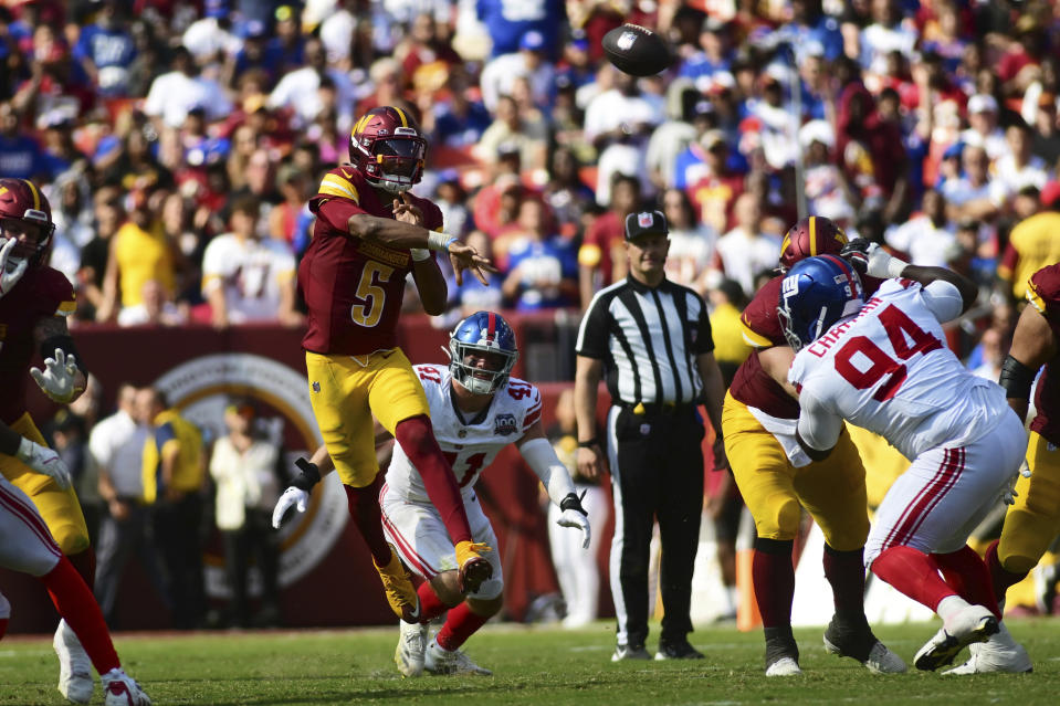 Washington Commanders quarterback Jayden Daniels (5) throws a pass against the New York Giants during the second half of an NFL football game in Landover, Md., Sunday, Sept. 15, 2024. (AP Photo/Steve Ruark)