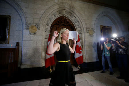 Canada's Environment Minister Catherine McKenna gestures as she arrives to speak to journalists on Parliament Hill in Ottawa, Ontario, Canada May 18, 2017. REUTERS/Chris Wattie