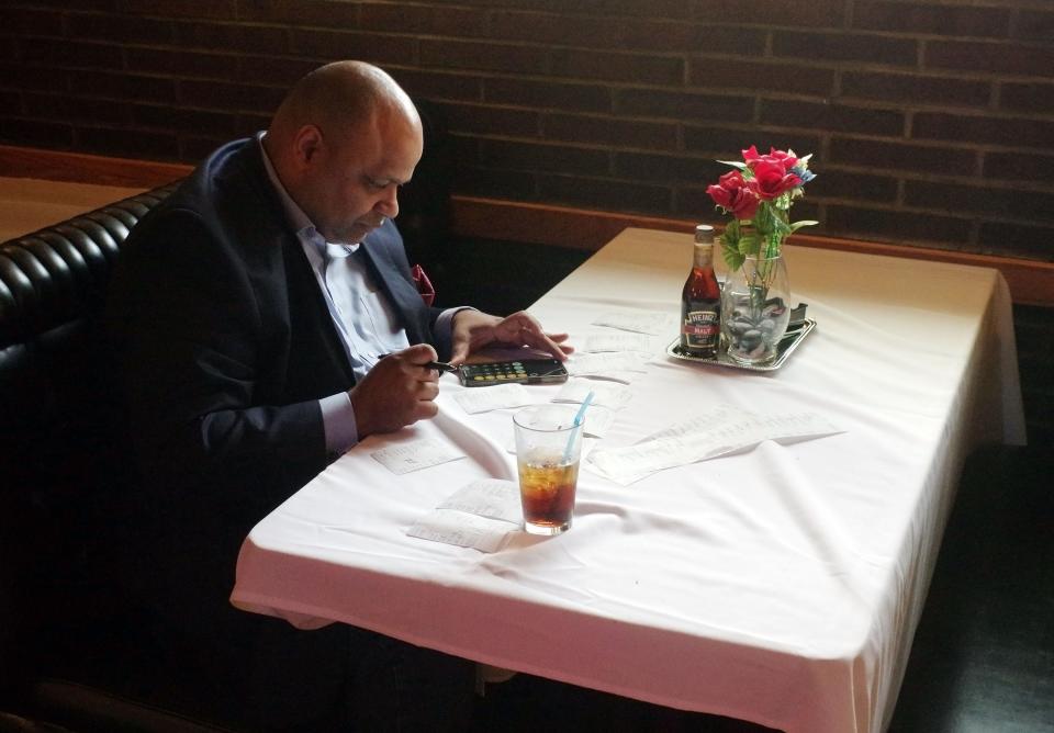 Brockton mayoral candidate Hamilton Rodrigues has a staff working at his restaurant, George's, but still checks in regularly going over the numbers, as he is here on Friday, June 9, 2023. 




















Friday, June 9, 2023.