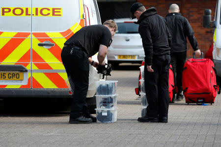 Police officers prepare equipment as inspectors from the Prohibition of Chemical Weapons (OPCW) begin work at the scene of the nerve agent attack on former Russian agent Sergei Skripal, in Salisbury, Britain March 21, 2018. REUTERS/Peter Nicholls