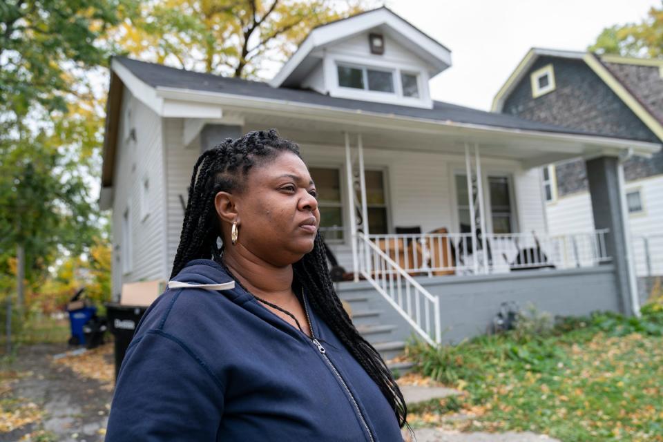 Elisha Maxwell stands out in front of the Beechdale Ave. house on Oct. 18, 2022, that she was renting and is now moving from that is infested with roaches and flies and a host of other issues. The Detroit Free Press is looking into a number of rental homes in Detroit that are in bad shape and concerns from tenants, who are being evicted and advocates. They are raising the alarm about terrible conditions.