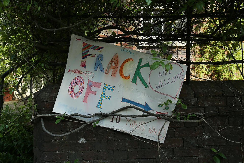 CRAWLEY, WEST SUSSEX - AUGUST 02:  A 'Frack Off' sign sits in window in Balcombe, close to a Fracking site operated by Cuadrilla Resources Ltd on August 2, 2013 in Crawley, West Sussex. Protesters continue to gather outside the Balcombe plant in West Sussex in opposition to the controversial method of extracting energy out of the ground called 'fracking'.  (Photo by Dan Kitwood/Getty Images)