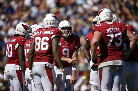 Sep 16, 2018; Los Angeles, CA, USA; Arizona Cardinals quarterback Sam Bradford (9) huddles with his team during the second half against the Los Angeles Rams at Los Angeles Memorial Coliseum. Mandatory Credit: Kelvin Kuo-USA TODAY Sports