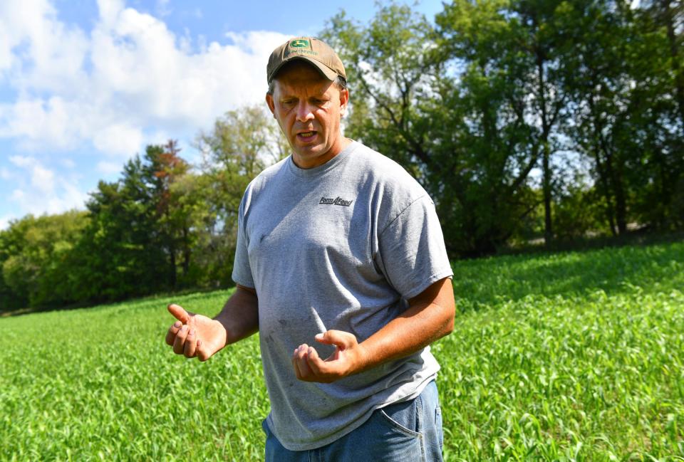 Farmer Jason Lorenz talks about a field he recently planted with cover crops Tuesday, Aug. 31, 2021, near Little Falls.