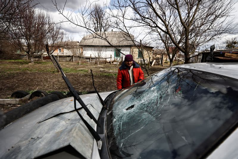 The Wider Image: Behind enemy lines, Ukrainian woman survives with her chickens