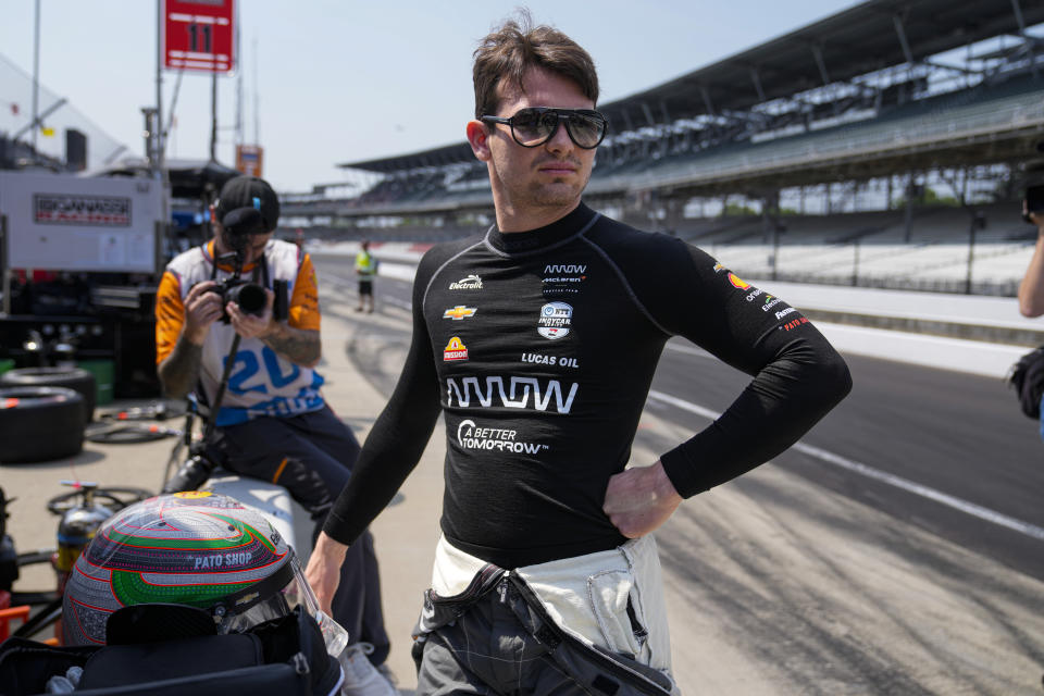 Pato O'Ward, of Mexico, watches from the pit area during practice for the Indianapolis 500 auto race at Indianapolis Motor Speedway in Indianapolis, Friday, May 19, 2023. (AP Photo/Michael Conroy)