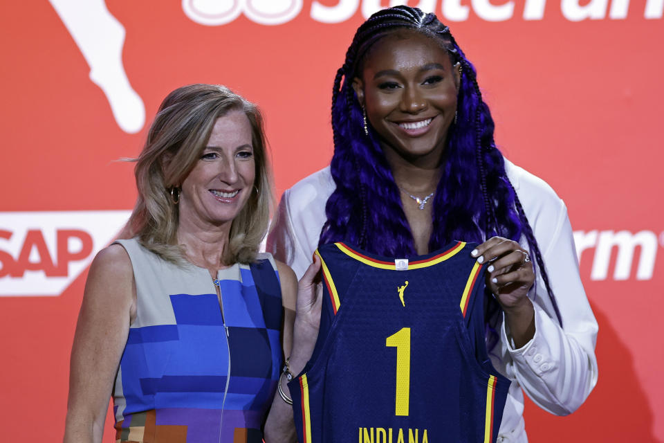 South Carolina's Aliyah Boston, right, poses for a photo with commissioner Cathy Engelbert after the Indiana Fever selected her first overall at the WNBA basketball draft Monday, April 10, 2023, in New York. (AP Photo/Adam Hunger)