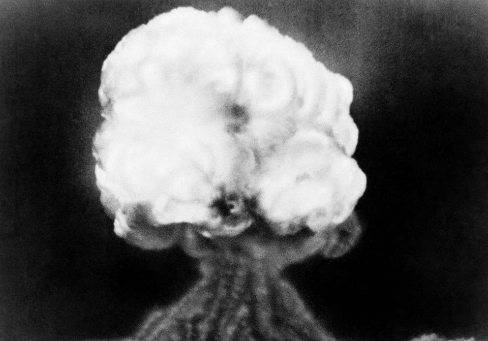 FILE - This July 16, 1945, file photo, shows the mushroom cloud of the first atomic explosion at Trinity Test Site near Alamagordo, N.M. A compensation program for those exposed to radiation from years of nuclear weapons testing and uranium mining would be expanded under legislation that seeks to address fallout across the western United States, Guam and the Northern Mariana Islands. (AP Photo/File)