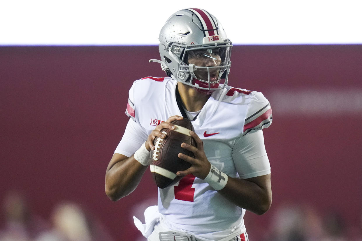 Ohio State quarterback C.J. Stroud (7) looks to pass while playing Indiana during the first quarter of an NCAA college football game in Bloomington, Ind., Saturday, Oct. 23, 2021. (AP Photo/AJ Mast)