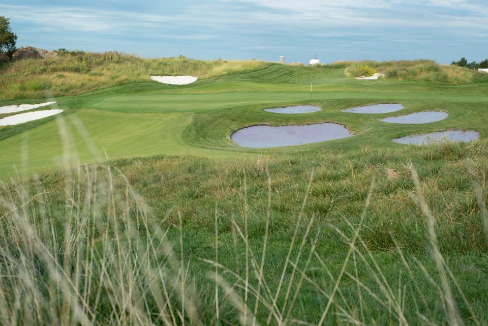 A sand trap in the shape of a paw print is a distinct feature of the fifth hole at Manhattan's Colbert Hills Golf Course.