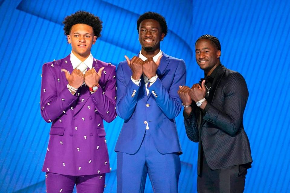 Duke University basketball players, from left, Paolo Banchero, A.J. Griffin, and Mark Williams pose for photos before the start of the NBA basketball draft, Thursday, June 23, 2022, in New York. 