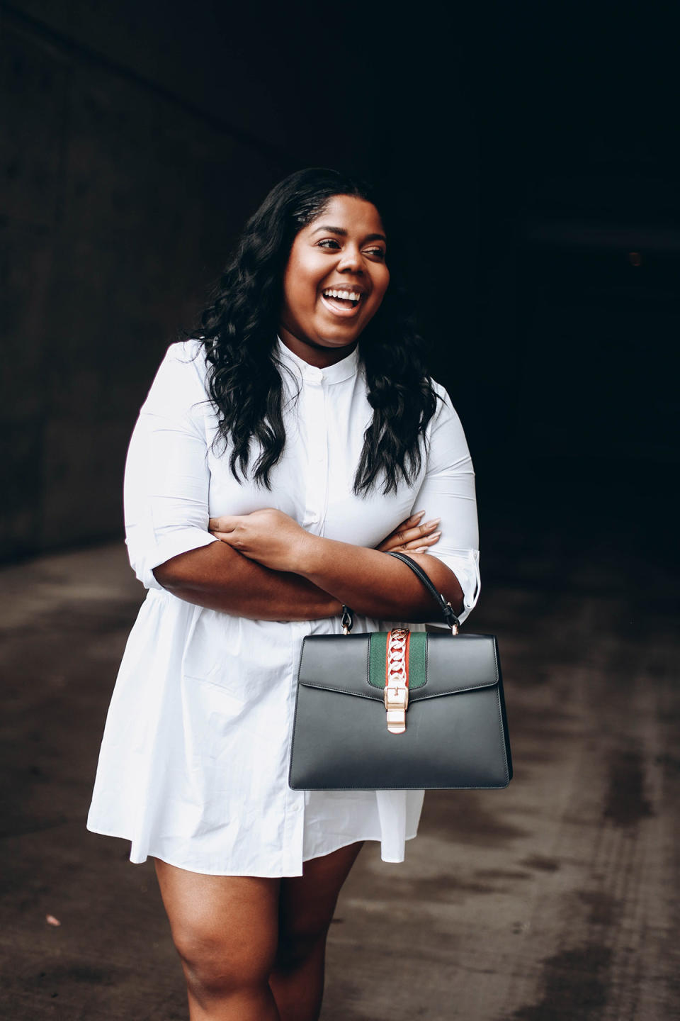 Hayet Rida in a white shirtdress and carrying a Gucci handbag. (Photo: Courtesy of Hayet Rida)