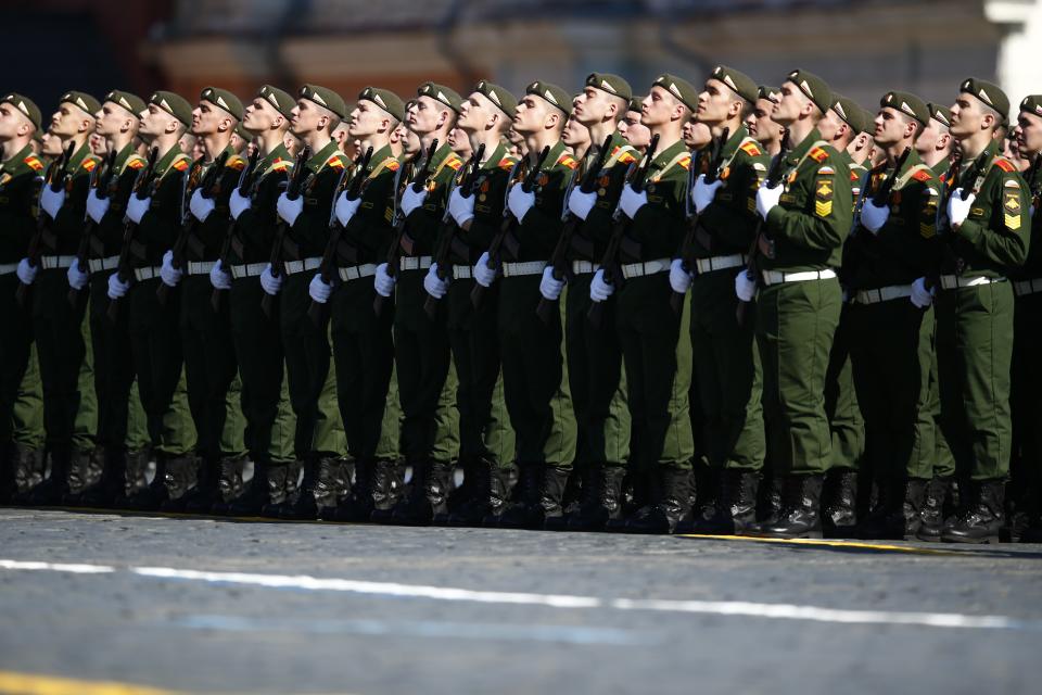 Russian troops stand in lines during a Victory Day parade, which commemorates the 1945 defeat of Nazi Germany, at Red Square in Moscow, Russia, Friday, May 9, 2014. Russia marked the Victory Day on May 9 holding a military parade at Red Square. (AP Photo/Pavel Golovkin)