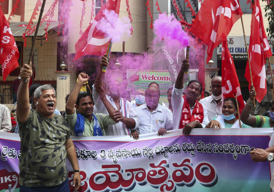 Activists of various organizations celebrate news of the repeal of farm laws they were protesting against in Hyderabad, India, Friday, Nov. 19, 2021. In a surprise announcement, India's Prime Minister Narendra Modi said Friday his government will withdraw the controversial agriculture laws that prompted yearlong protests from tens of thousands of farmers and posed a significant political challenge to his administration. (AP Photo/Mahesh Kumar A.)