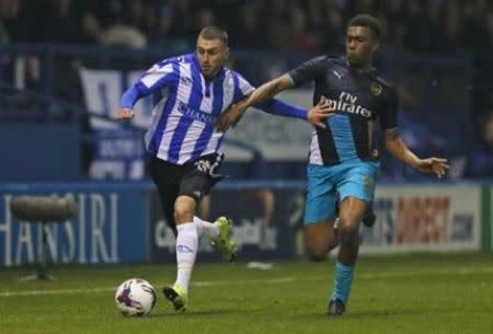 Football - Sheffield Wednesday v Arsenal - Capital One Cup Fourth Round - Hillsborough - 27/10/15 Sheffield Wednesday's Jack Hunt in action with Arsenal's Alex Iwobi Action Images via Reuters / Jason Cairnduff