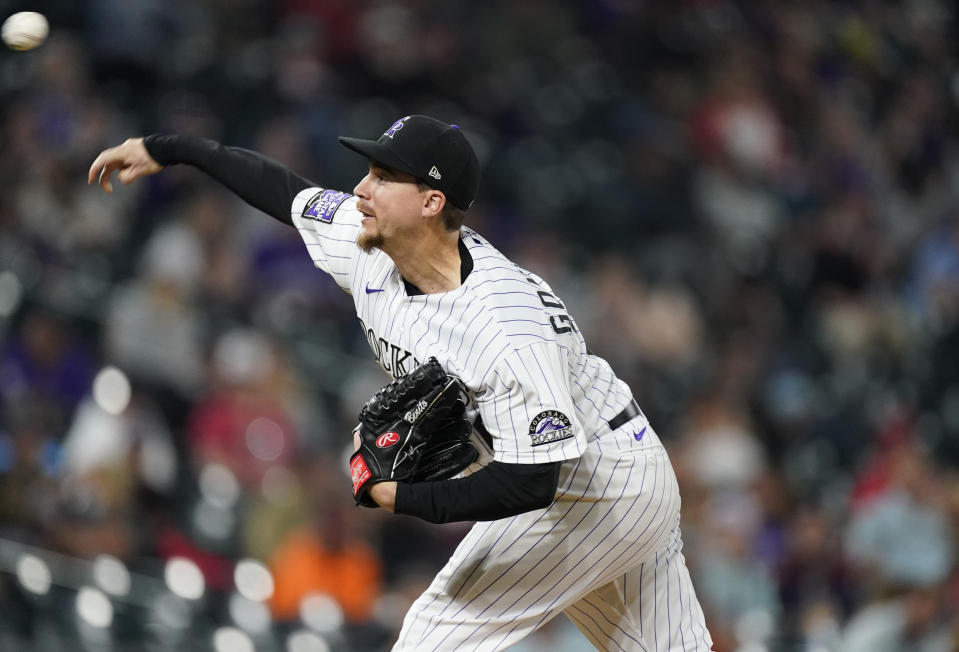 Colorado Rockies starting pitcher Chi Chi Gonzalez works against the Cincinnati Reds during the sixth inning of a baseball game Thursday, May 13, 2021, in Denver. (AP Photo/David Zalubowski)