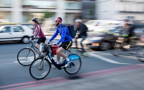 cycling to work - Credit: Simon Dawson/Bloomberg News