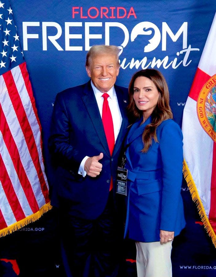 Florida state Sen. Ileana Garcia poses with leading Republican presidential candidate Donald Trump during the Florida Freedom Summit in November 2023. Garcia proposed, then withdrew, a bill that would make $5 million in state funds available for Trump's legal defense.