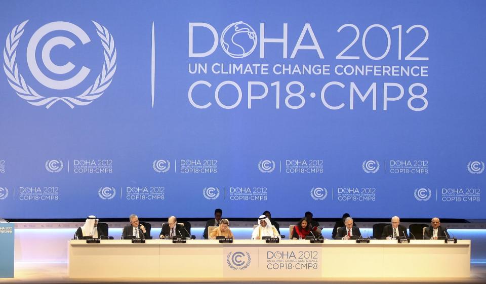 FILE - This Nov. 26, 2012 file photo shows organizers on stage at the opening ceremony of the 18th United Nations climate change conference in Doha, Qatar. The amount of heat-trapping pollution the world spewed rose again last year by 3 percent. So scientists say it's now unlikely global warming can be limited by more than a couple degrees, which is an international goal. (AP Photo/Osama Faisal, File)