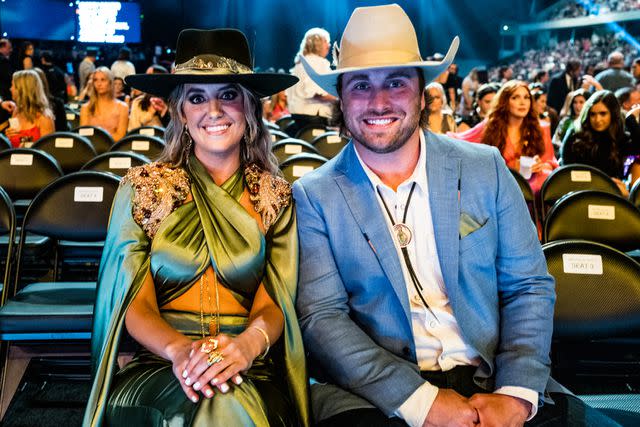 <p>John Shearer/Getty</p> Lainey Wilson and Devlin "Duck" Hodges at the 2023 ACM Awards