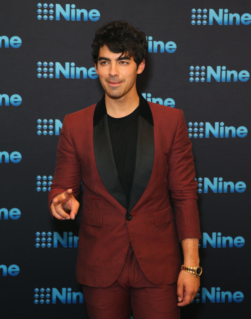 Joe Jonas has revealed what it’s like for him working on The Voice with his brother’s ex-girlfriend Delta Goodrem. Source: Getty