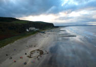 <p>A portrait drawn in the sand of British Army Staff Nurse Rachael Ferguson (1886-26 June 1918) on Downhill beach, Northern Ireland. (Photo by Charles McQuillan/Getty Images) </p>