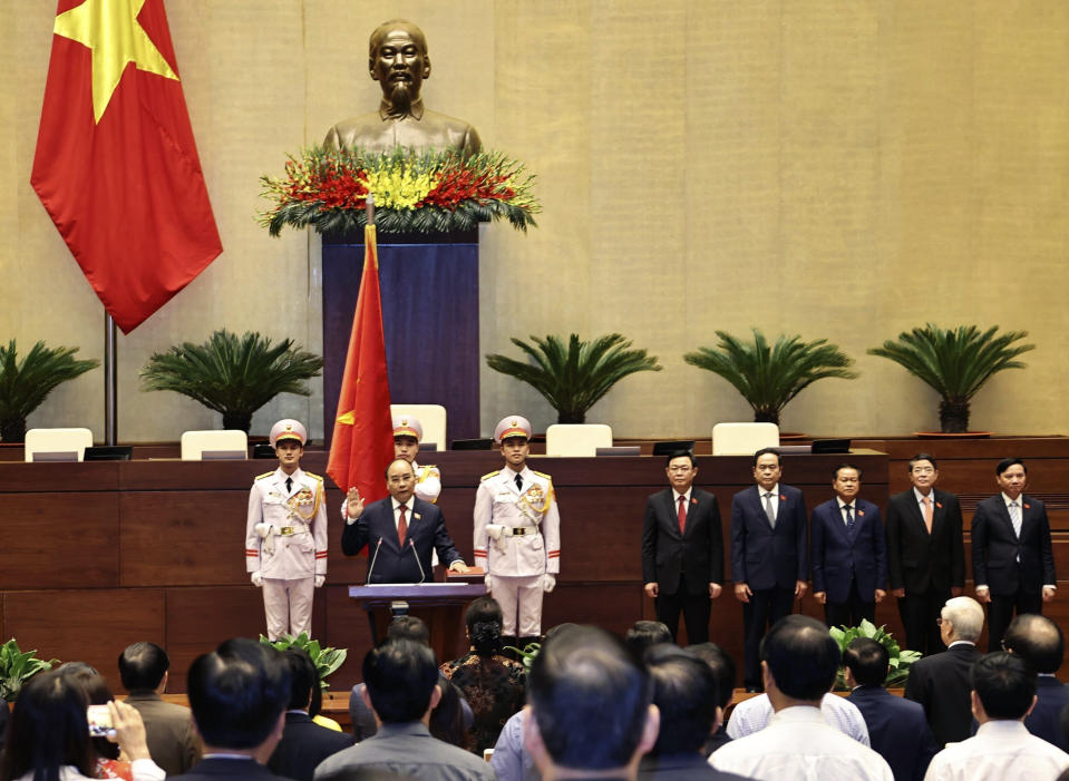 Vietnamese newly elected President Nguyen Xuan Phuc takes an oath in front of the National Assembly in Hanoi, Vietnam on Monday, April 5, 2021. Vietnam's legislature voted Monday to make Pham Minh Chinh, a member of the Communist party's central committee for personnel and organization, the country's next prime minister. Outgoing Prime Minister Nguyen Xuan Phuc was appointed the new president. (Nguyen Trong Duc/ VNA via AP)