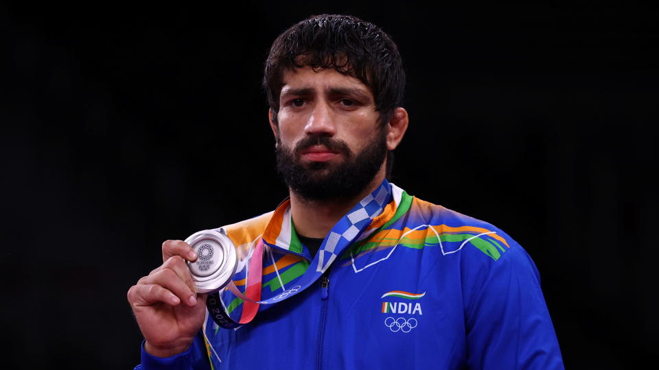 Tokyo 2020 Olympics - Wrestling - Freestyle - Men's 57kg - Medal Ceremony - Makuhari Messe Hall A, Chiba, Japan - August 5, 2021. Silver medallist Ravi Kumar of India poses with his medal. REUTERS/Leah Millis