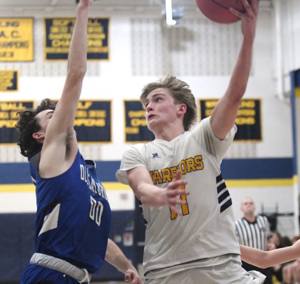 Norwich Tech's Josh Lodyko shoots around Old Saybrook's Greyson Richards earlier this season in Norwich.