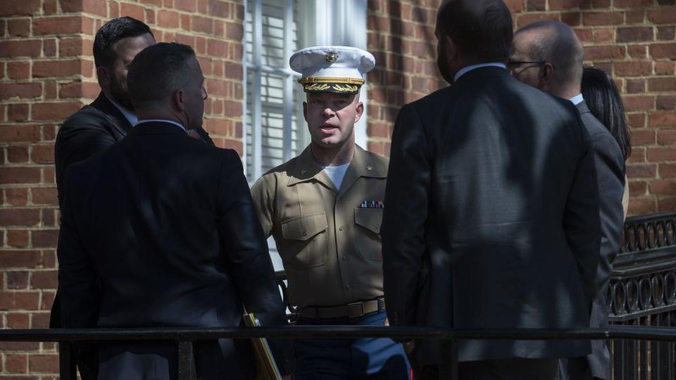 FILE - U.S. Marine Corps Major Joshua Mast, center, talks with his attorneys during a break in the hearing in an ongoing custody battle over an Afghan orphan, at the Circuit Courthouse in Charlottesville, Va., Thursday, March 30, 2023. (Cliff Owen/AP, File)