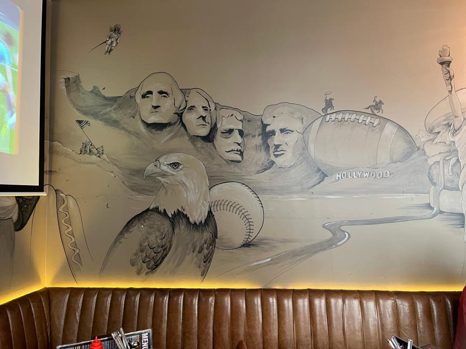 A Mount Rushmore mural inside American Bar in Iceland.