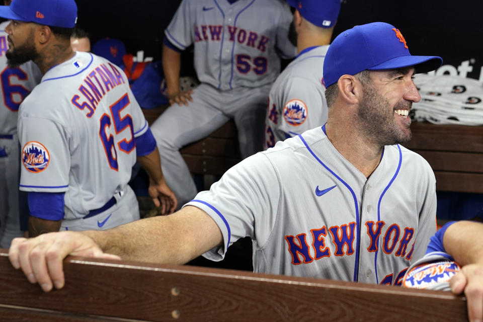 New York Mets pitcher Justin Verlander smiles in the dugout before an opening day baseball game against the Miami Marlins, Thursday, March 30, 2023, in Miami. (AP Photo/Lynne Sladky)