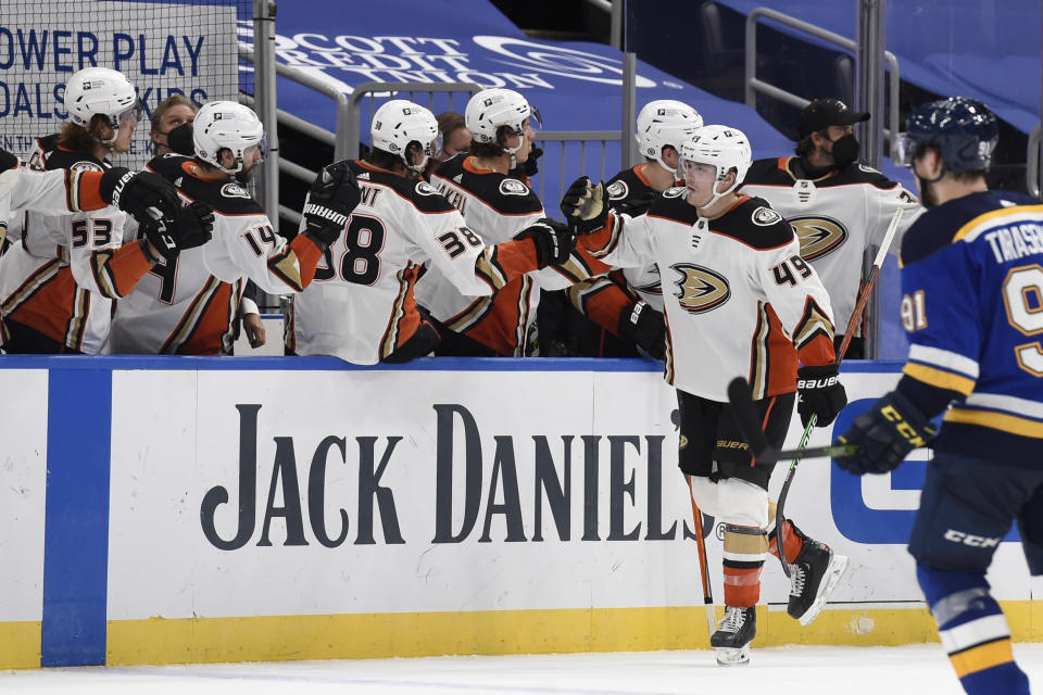 Anaheim Ducks' Max Jones (49) is congratulated by teammates after scoring a goal against the St. Louis Blues during the second period of an NHL hockey game Friday, March 26, 2021, in St. Louis. (AP Photo/Joe Puetz)