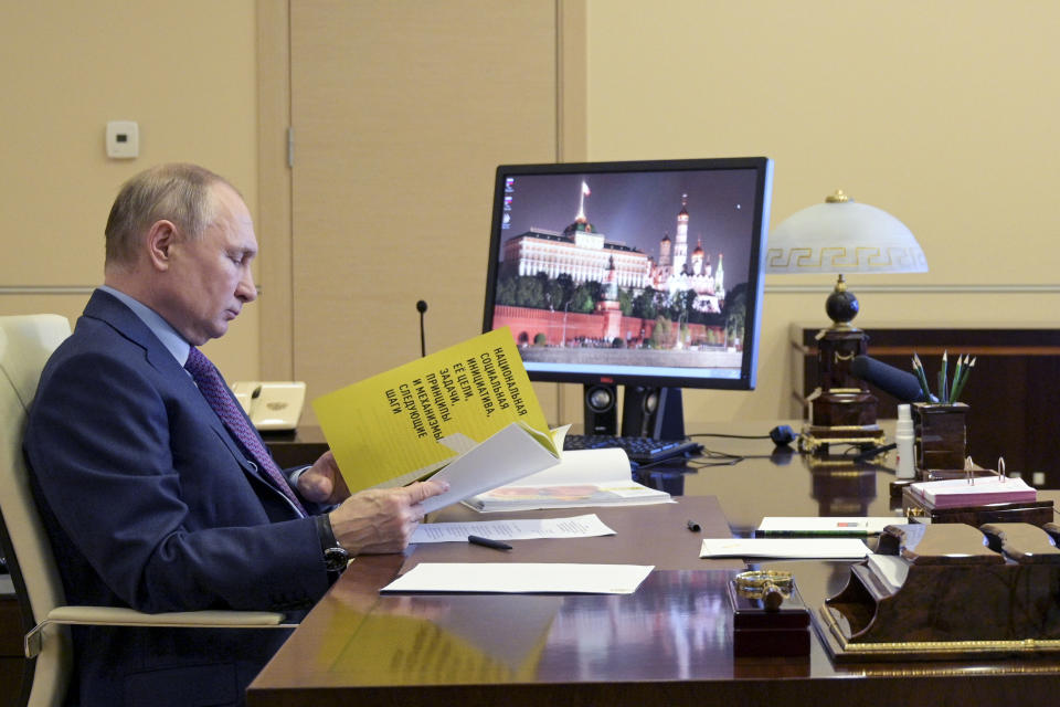 Russian President Vladimir Putin attends a meeting via video conference at the Novo-Ogaryovo residence outside Moscow, Russia, Thursday, April 15, 2021. (Alexei Druzhinin, Sputnik, Kremlin Pool Photo via AP)