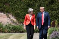 Britain's Prime Minister Theresa May and U.S. President Donald Trump arrive for a joint news conference in the grounds of Chequers near Aylesbury, Britain July 13, 2018. Jack Taylor/Pool via REUTERS