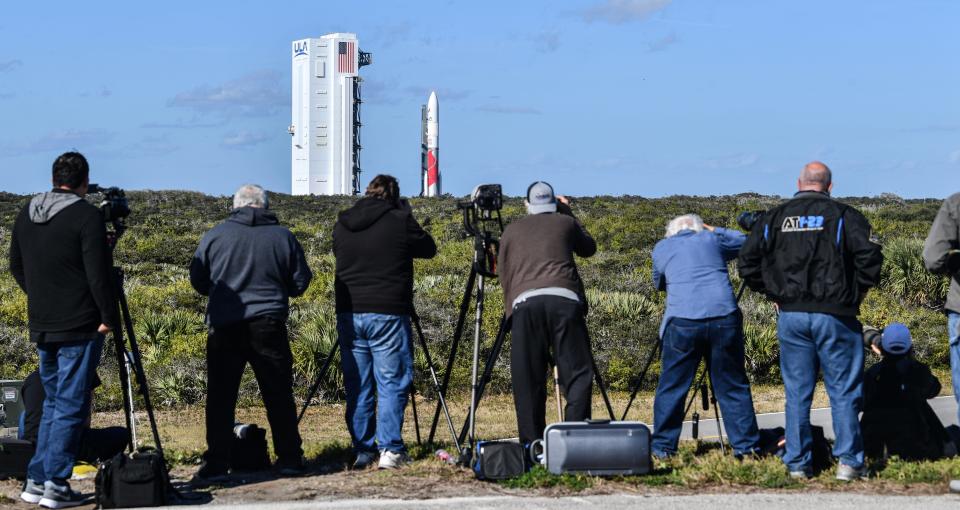 Members of the media photograph a United Launch Alliance Vulcan rocket as it rolls out to the launch pad Friday at Cape Canaveral Space Force Station.