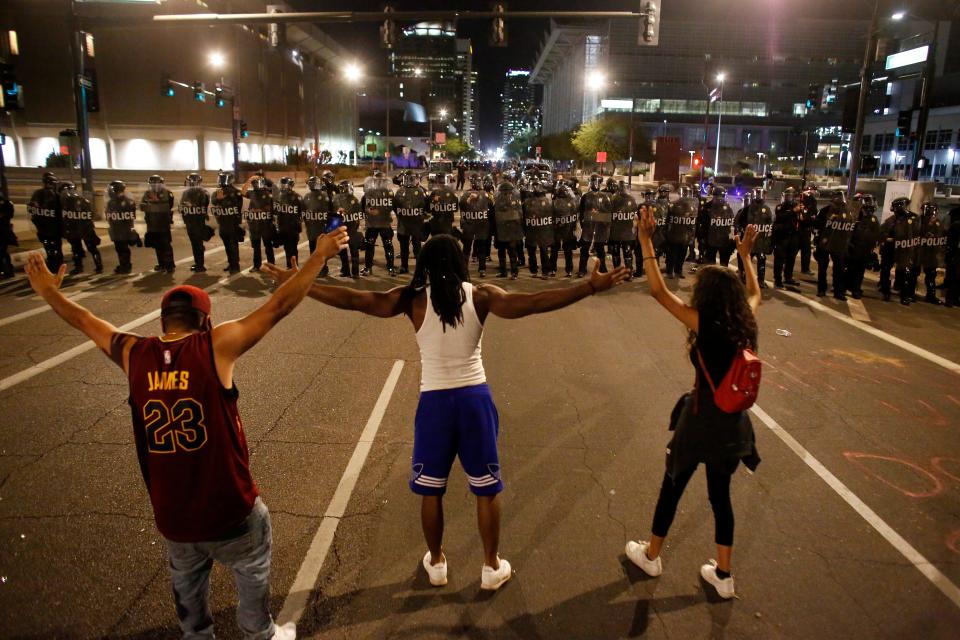 Police and protesters face off during a Justice for George Floyd rally in downtown Phoenix on May 28, 2020.