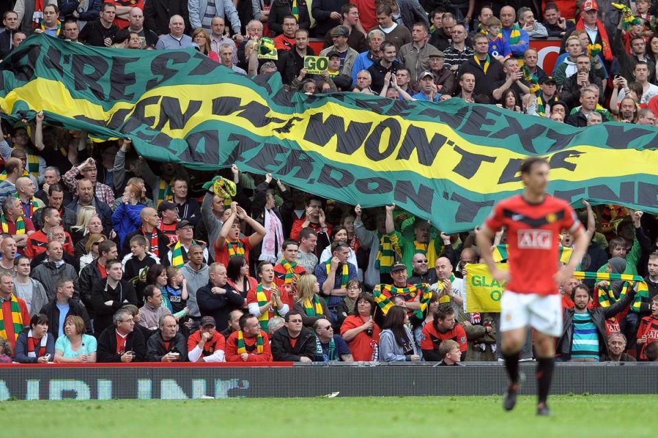 Supporters have been calling for Glazers to sell United for so long, Gary Neville was still a player during the protests  (AFP/Getty Images)