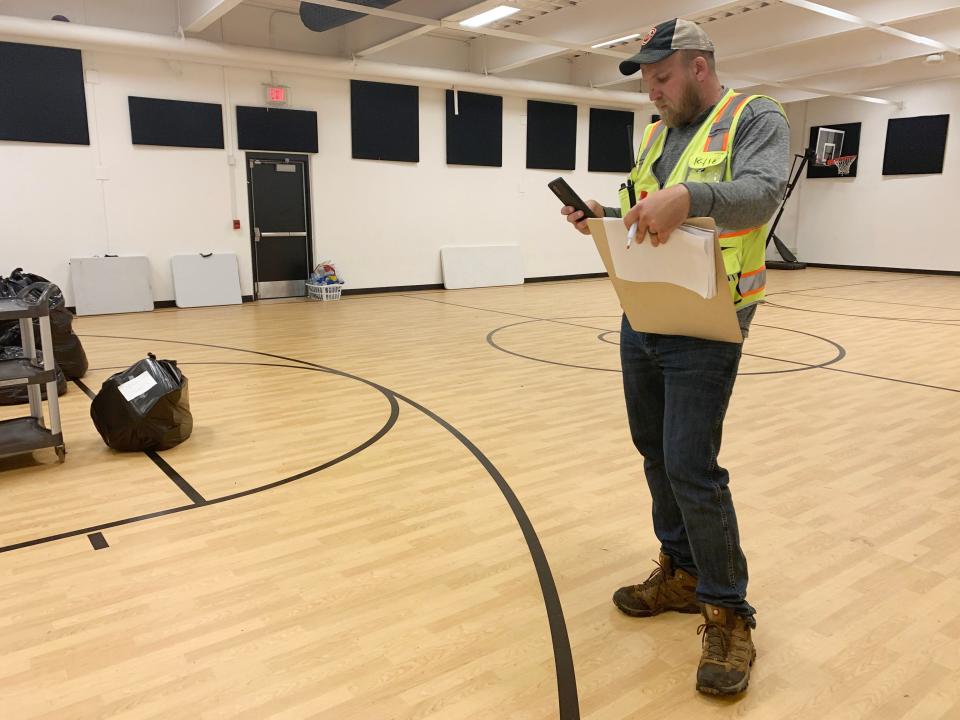 Kyle Minyard coordinates relief efforts after a tornado damaged Marietta's only hospital, grocery store and the community's largest employer. Most residents remain without power.