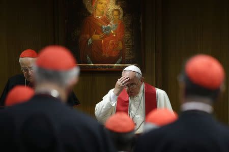 Pope Francis makes the sign of the cross as he leads a consistory for the beatification of Giuseppe Vaz and Maria Cristina dell'Immacolata Concezione in the Synod Hall at the Vatican October 20, 2014. REUTERS/Max Rossi