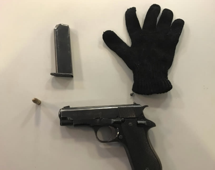 This image provided by U.S. Attorney's Office for the Eastern District of New York, shows a semi-automatic handgun and other evidence seized in undercover transactions in the Canarsie neighborhood of the Brooklyn borough of New York. Four men charged Wednesday, Jan 11, 2023, under a new federal gun trafficking law are accused of selling more than 50 guns to an undercover officer, along with fentanyl and crack cocaine. (U.S. Attorney's Office for the Eastern District of New York via AP)