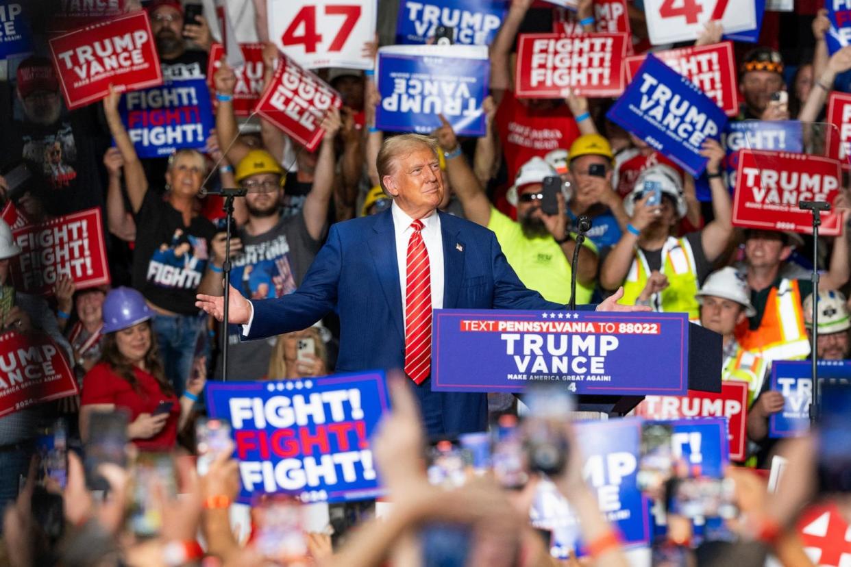 PHOTO: Former President and Republican presidential candidate Donald Trump reacts as he arrives to speak at a rally at 1st Summit Arena at the Cambria County War Memorial in Johnstown, Penn., on Aug. 30, 2024. (Roberto Schmidt/AFP via Getty Images, FILE)