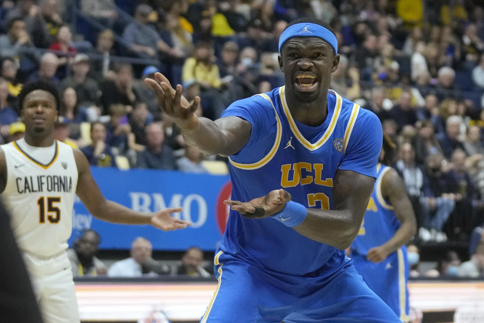 UCLA forward Adem Bona, foreground, reacts toward officials after scoring and being fouled in front of California guard Jalen Cone (15) during the second half of an NCAA college basketball game in Berkeley, Calif., Saturday, Feb. 10, 2024. (AP Photo/Jeff Chiu)