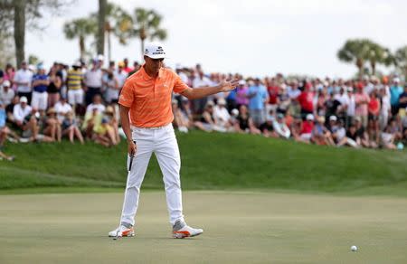 Feb 26, 2017; Palm Beach Gardens, FL, USA; Rickie Fowler reacts after a missed putt on the ninth hole during the final round of The Honda Classic at PGA National (Champion). Mandatory Credit: Jason Getz-USA TODAY Sports