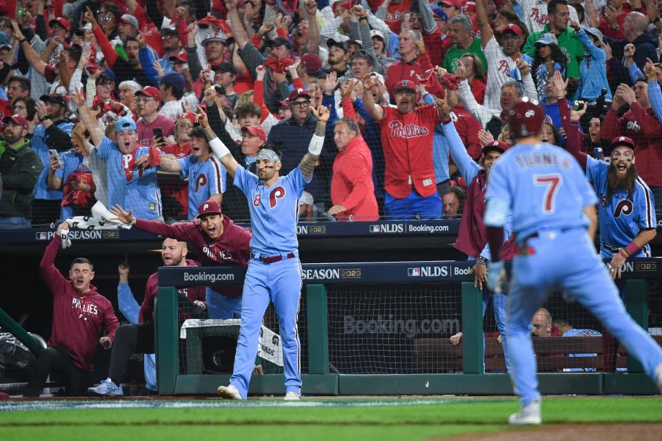 Nick Castellanos celebrates Trea Turner's home run in the fifth inning of Game 4.