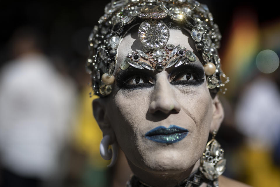 A man marches in the Gay Pride parade in Bogota, Colombia, Sunday, July 3, 2022. (AP Photo/Ivan Valencia)