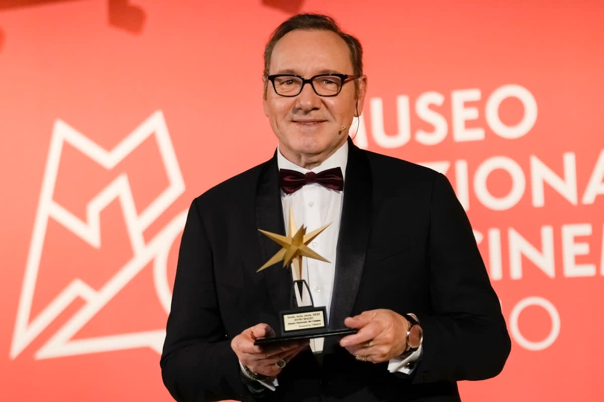 Actor Kevin Spacey poses with an award at the National Museum of Cinema in Turin (AP)