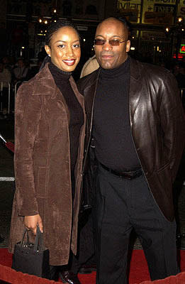 John Singleton and gal at the Hollywood premiere of Ali